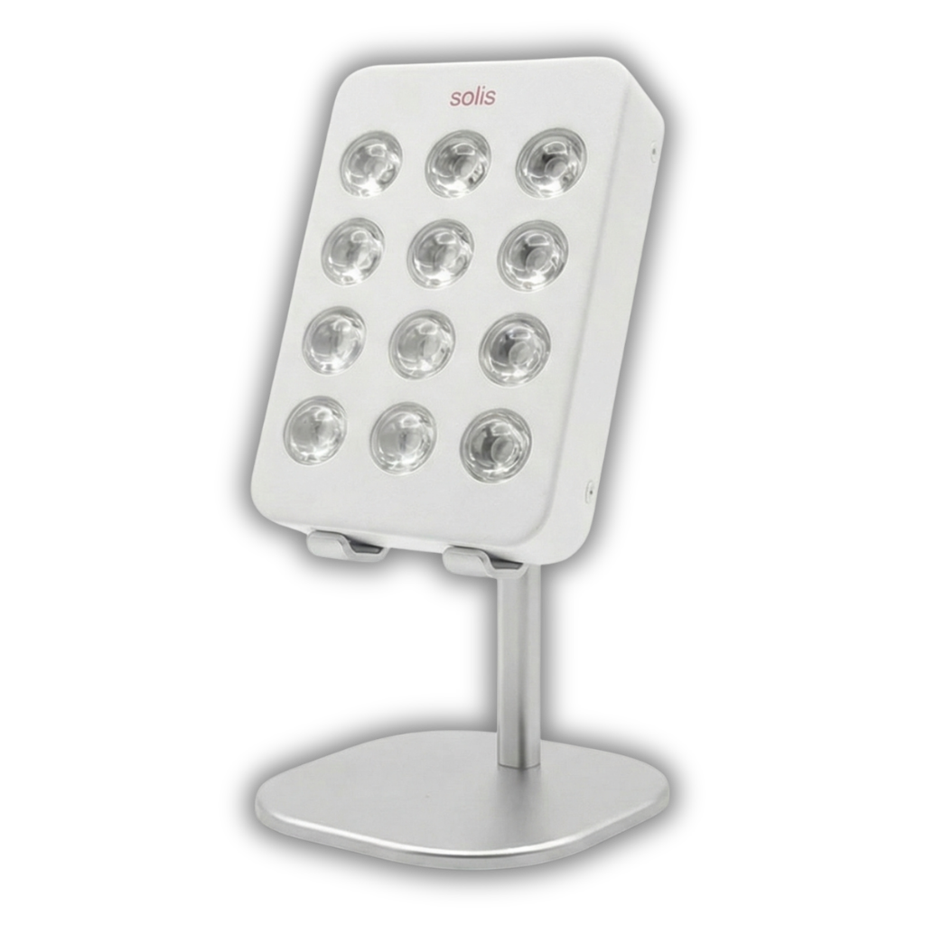 A white Solis LED light therapy panel with twelve bulbs, sitting on a silver stand against a white background.