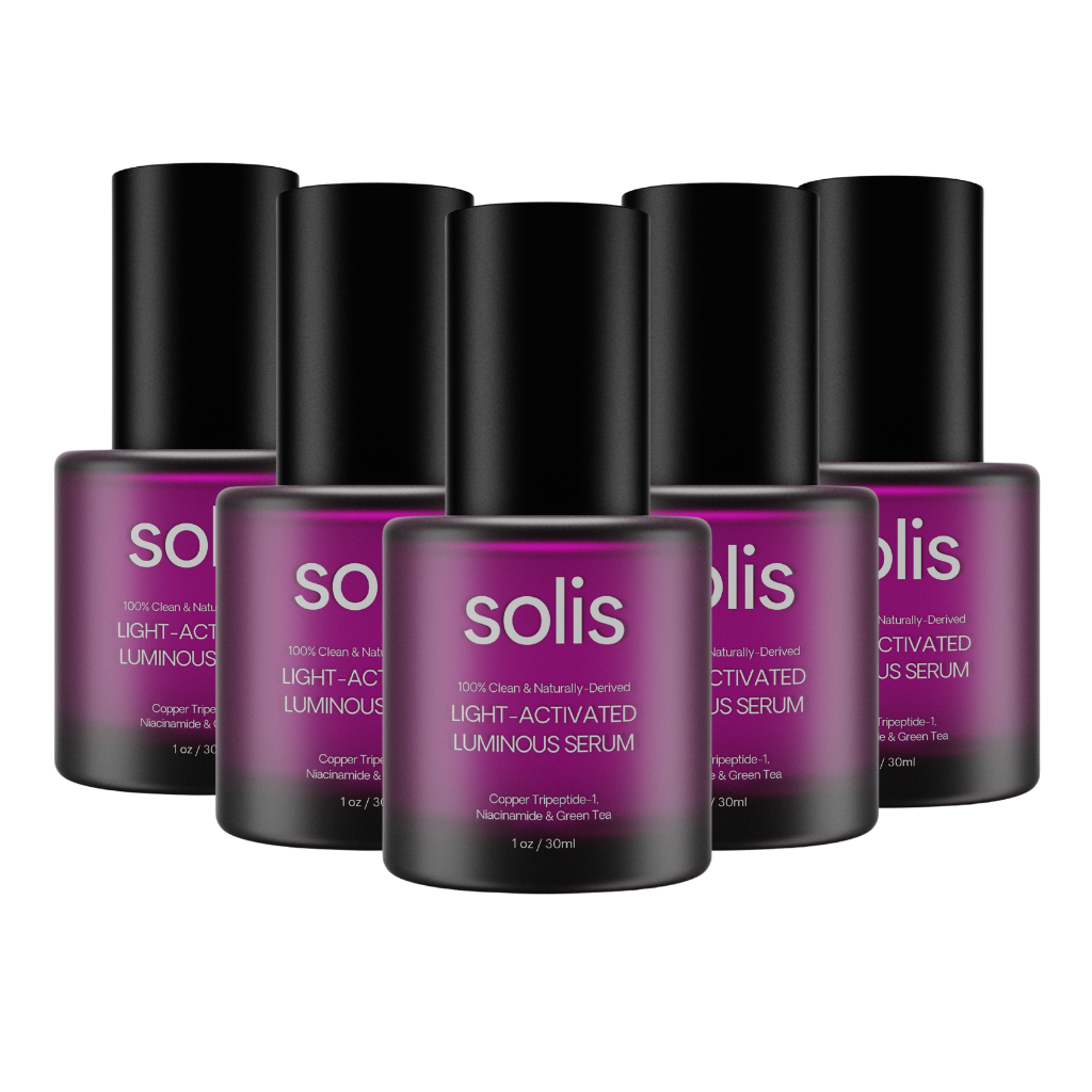 Six purple bottles of Solis Light-Activated Luminous Serum arranged in two rows on a white background.