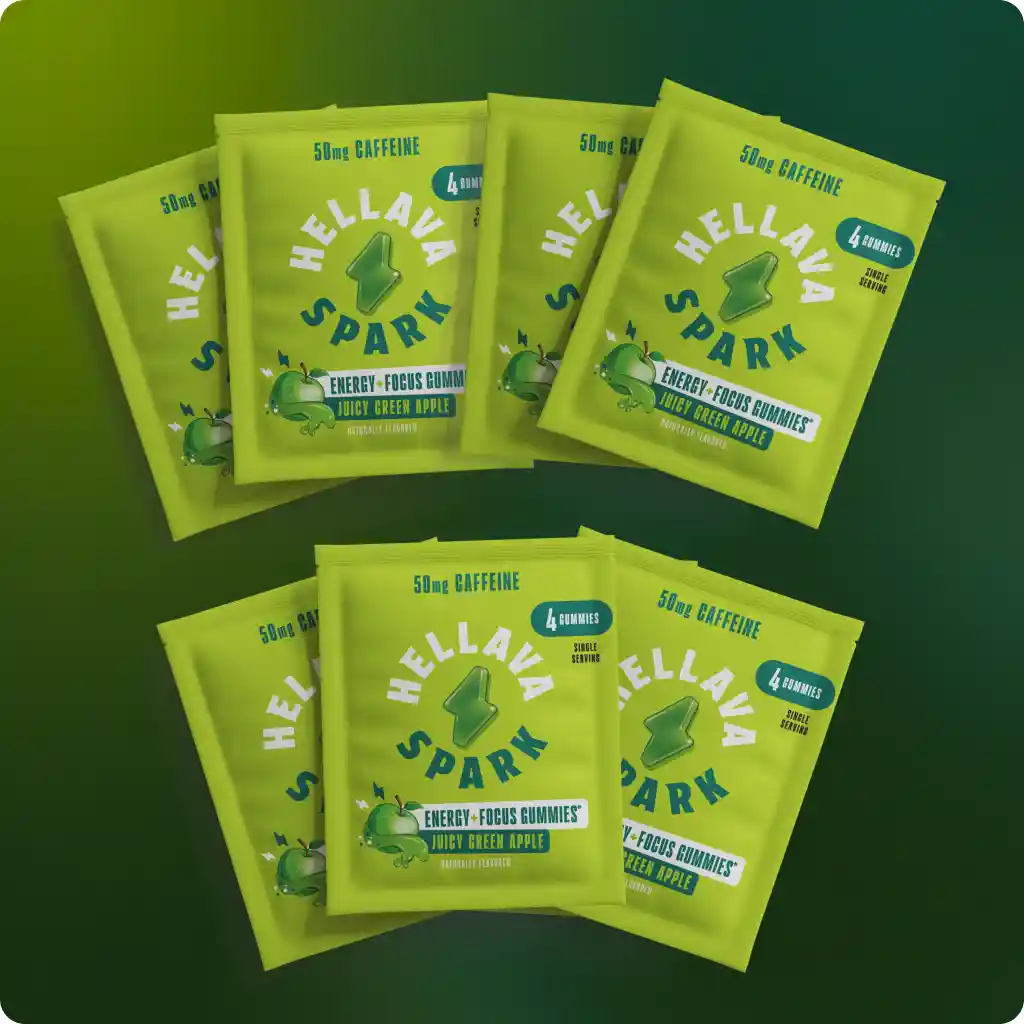 A pouch of Hellava Spark energy gummies with sample packets, a keychain, and other promotional items.