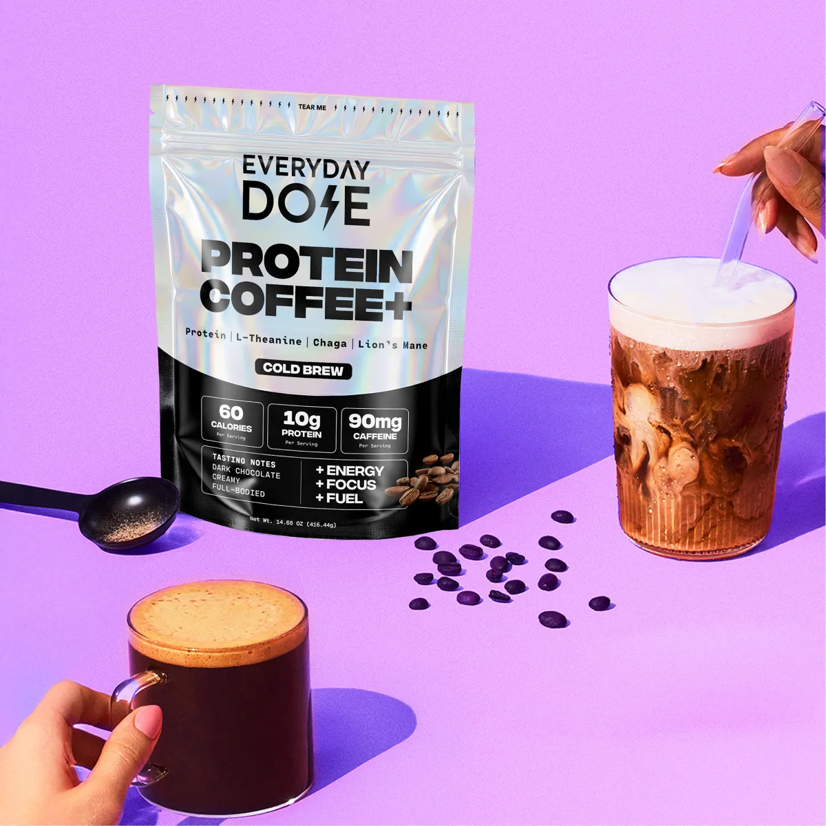 A pouch of Everyday Dose Protein Coffee+ sits next to prepared hot and iced coffee drinks.