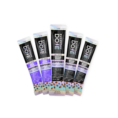 Five packets of Everyday Dose Coffee+ fanned out against a white background.