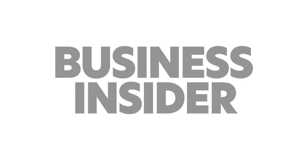 Business Insider logo in gray text on a transparent background.