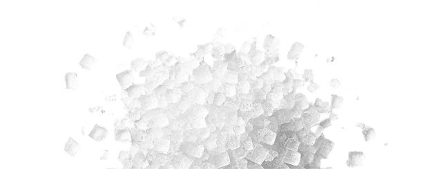A pile of white sugar cubes on a white background.