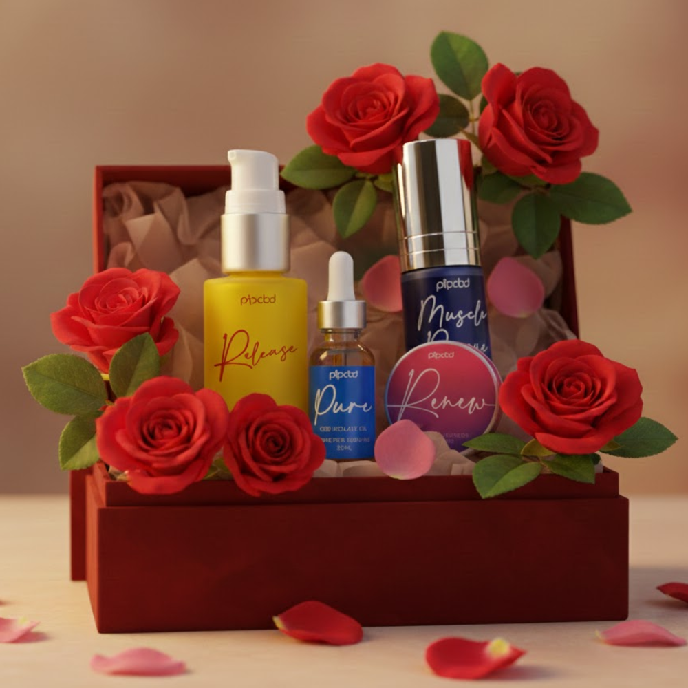 A collection of Pipcbd skincare products displayed in a red gift box surrounded by red roses.