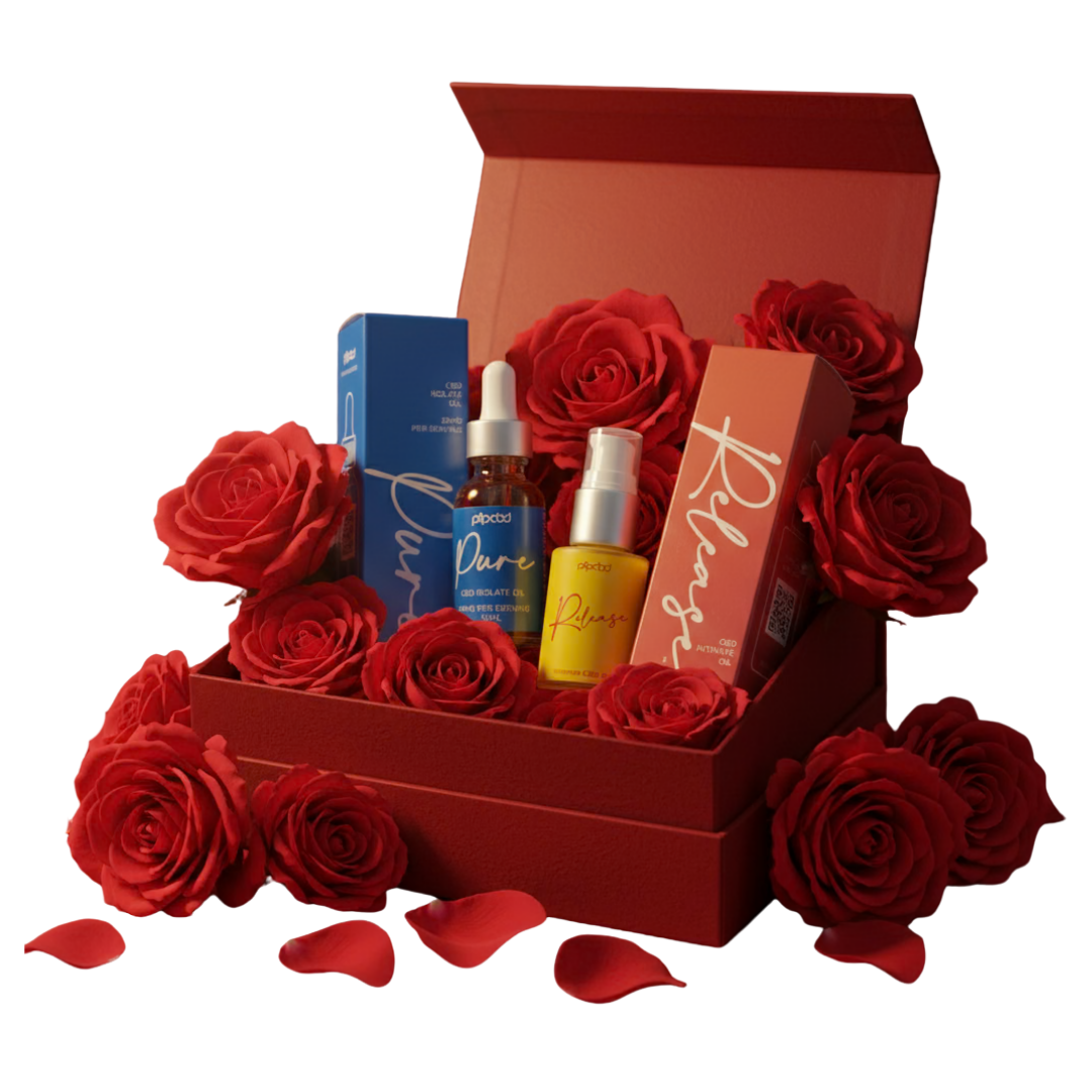 Two cosmetic products in a red gift box surrounded by red roses against a black background.
