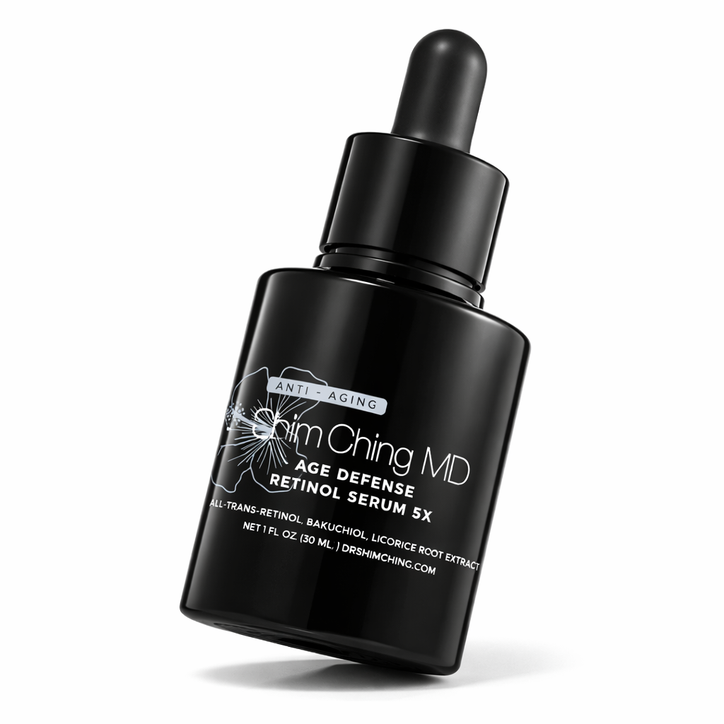 A black bottle of Shim Ching MD Age Defense Retinol Serum 5X on a white background.