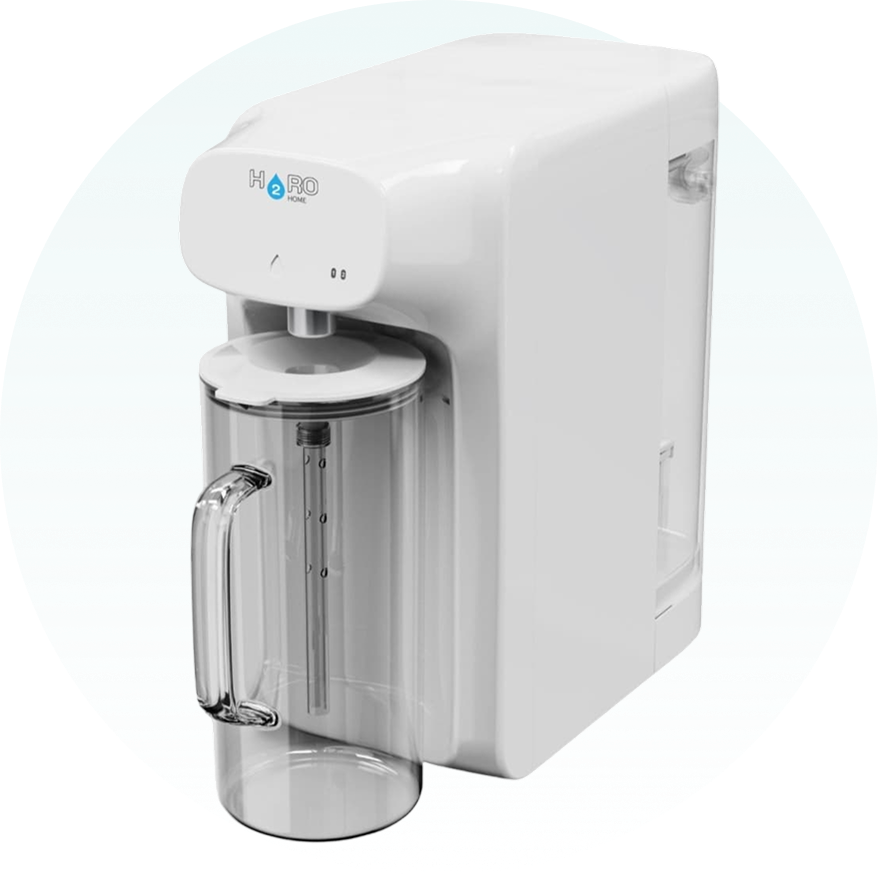 White water purifier with a transparent jug attached.