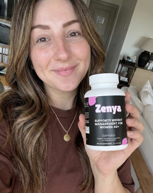 Person holding a bottle labeled 'Zenya' for weight management.
