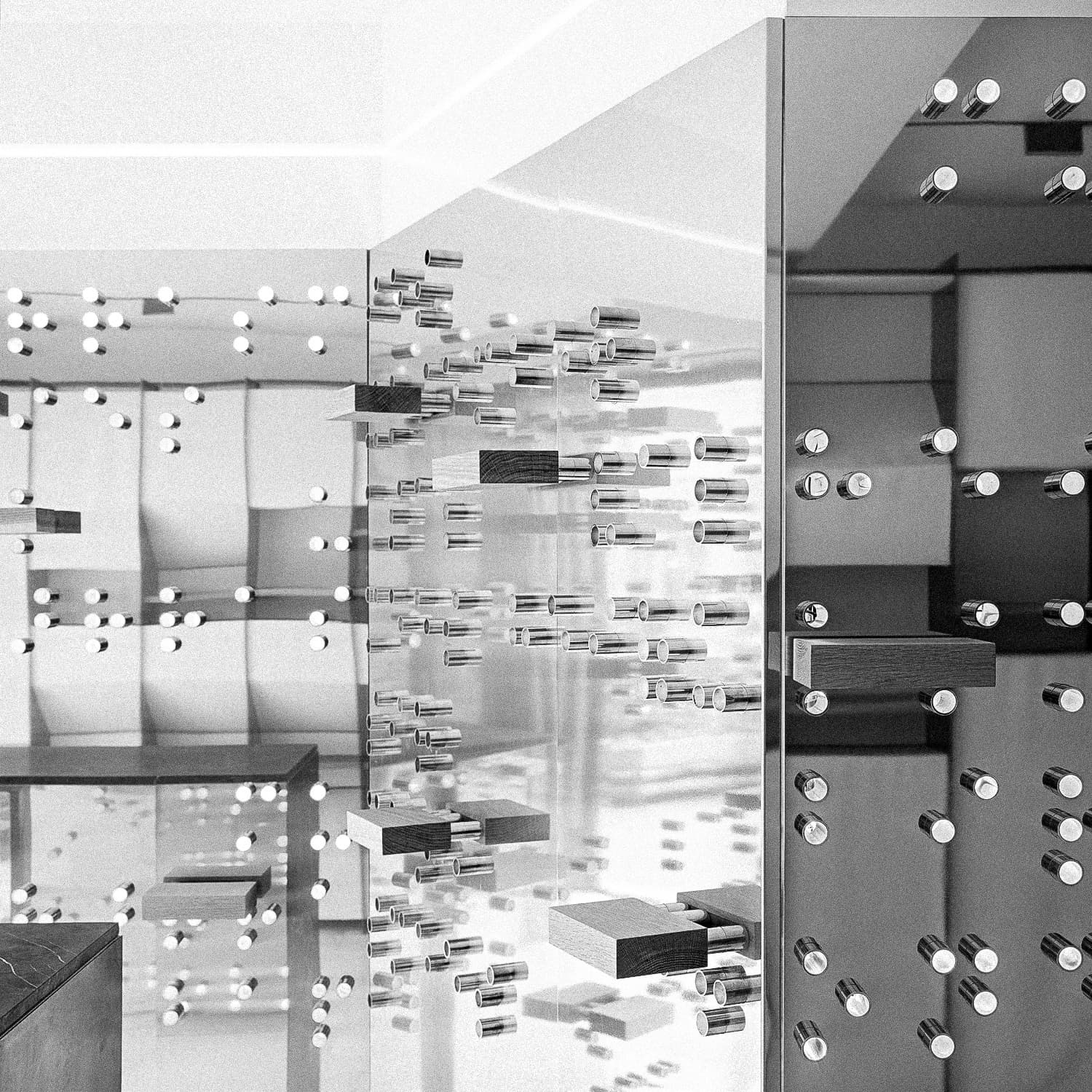 Abstract black and white image with reflective surfaces and cylindrical protrusions.
