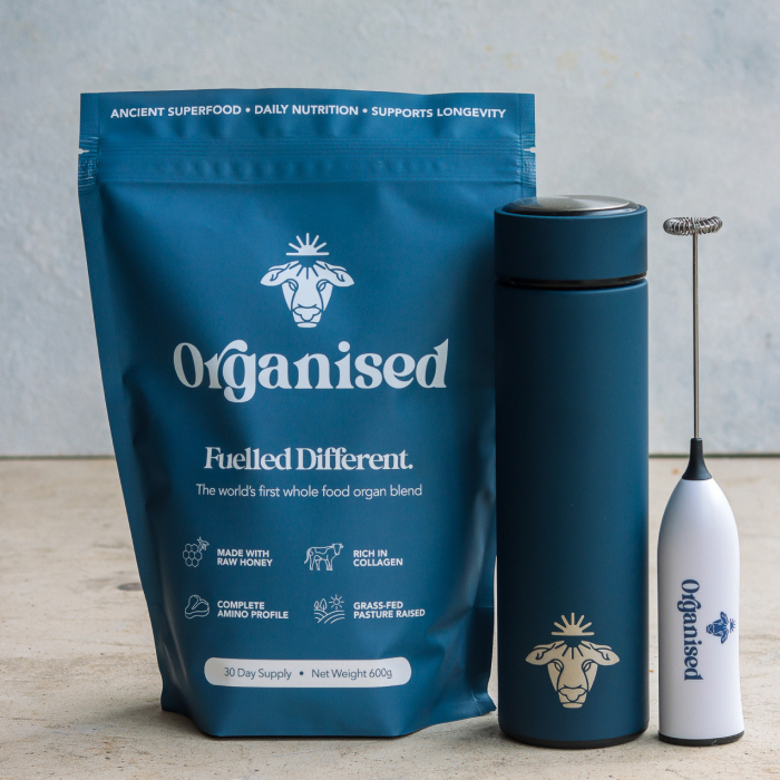 Blue package with a goat logo, tumbler, and frother on a surface.
