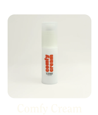 A white bottle of 'Comfy Cream' with red text on a neutral background.