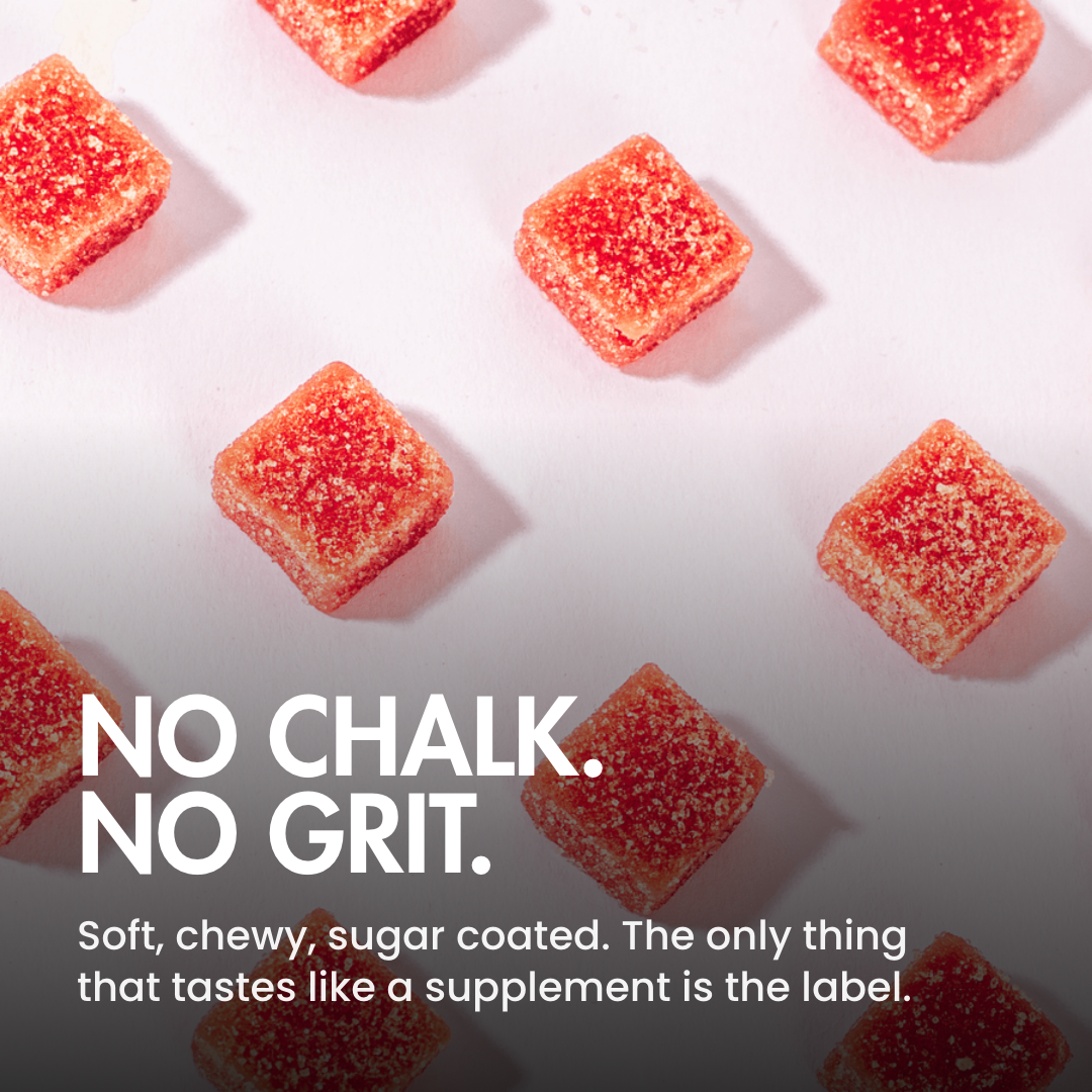 Red, square, sugar-coated gummies arranged in a pattern on a light-colored surface with text overlay.