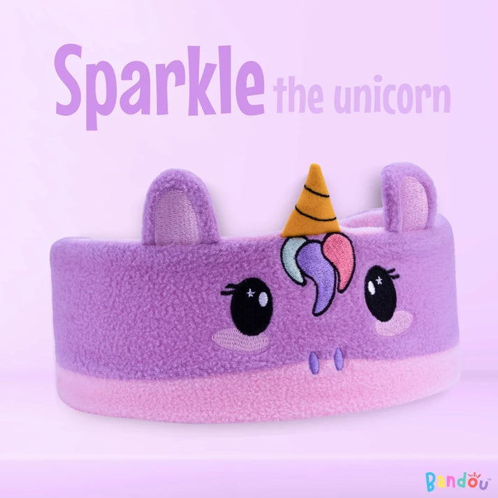 Purple unicorn-themed headband with ears and a multicolored horn.