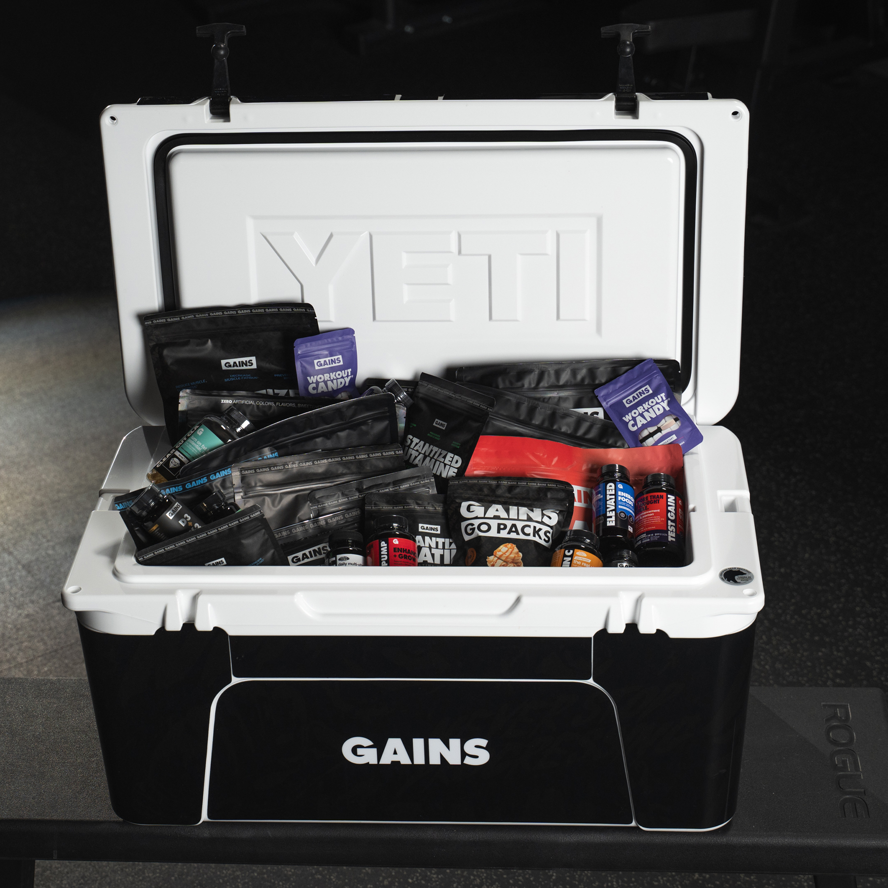 Open cooler filled with various fitness supplements and snacks.