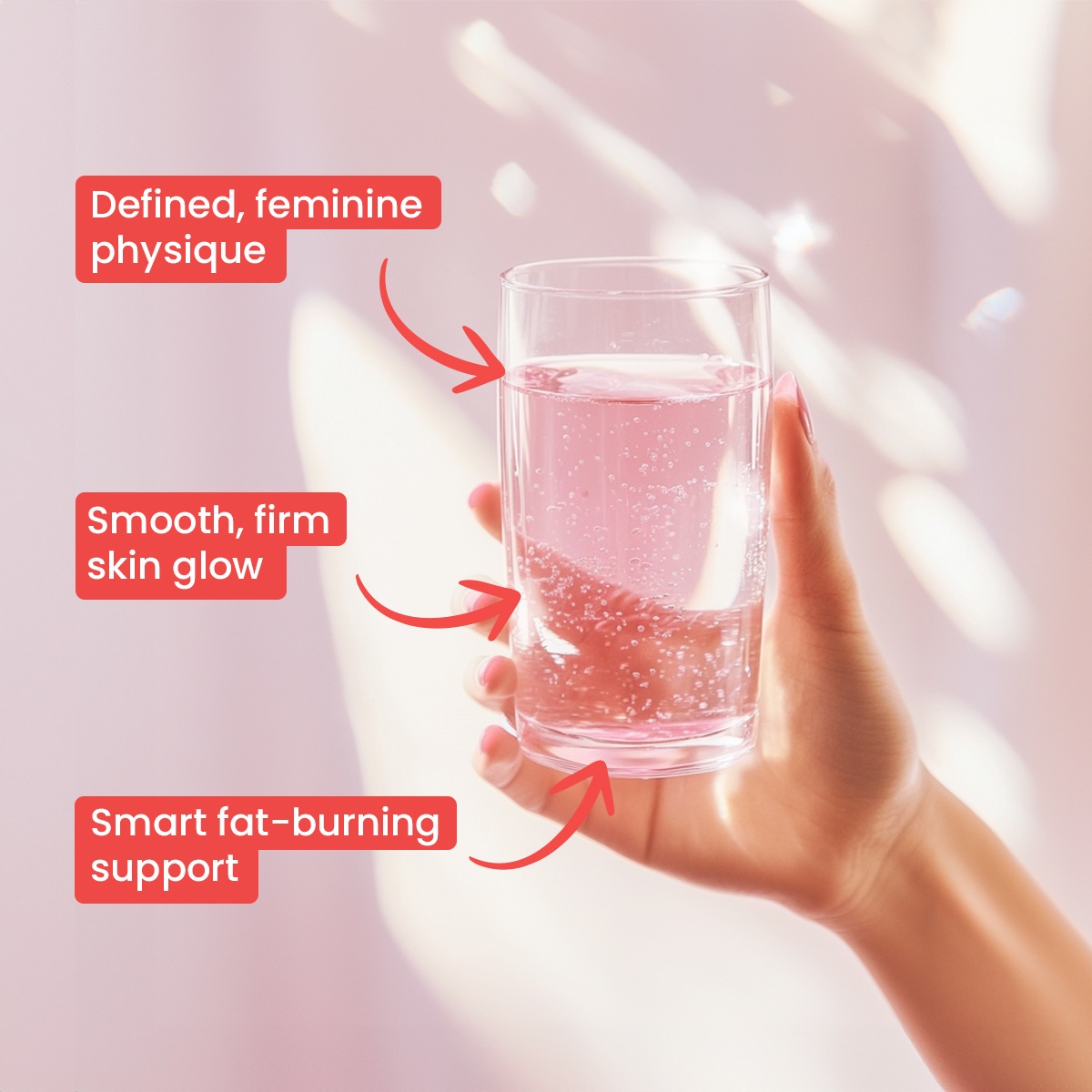 Hand holding a glass of pink sparkling water with text annotations.
