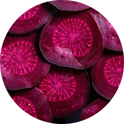A close-up, circular view of sliced purple root vegetables with a magenta starburst pattern inside.