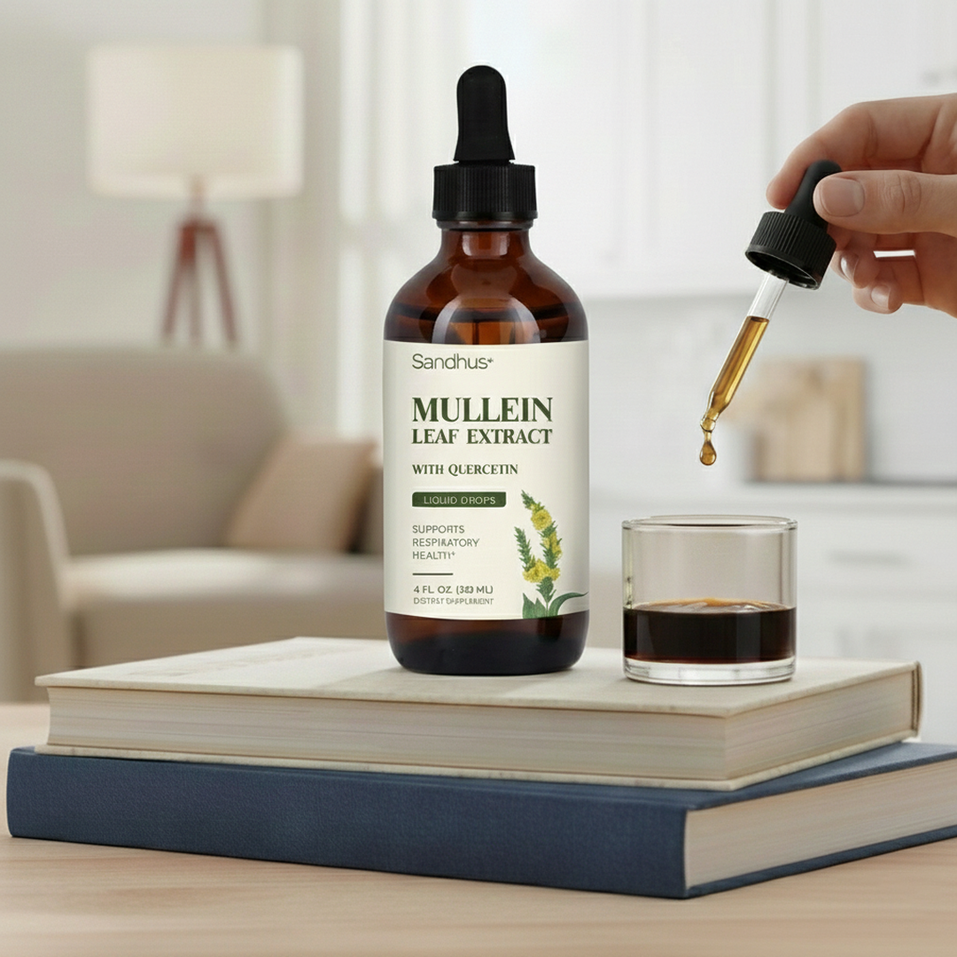 Mullein leaf extract bottle with dropper above a glass on stacked books.