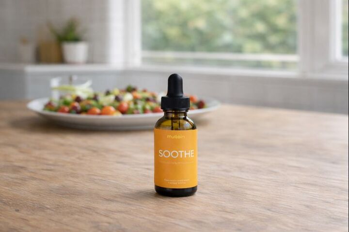 A bottle and box of Mullein Soothe dietary supplement against a black background.