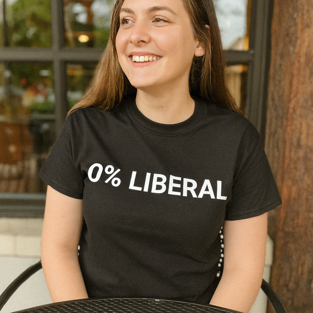 Person wearing a black shirt with '0% LIBERAL' text, sitting at an outdoor café.