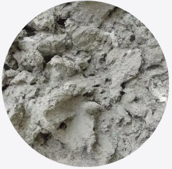 Close-up of rough, textured gray concrete surface.