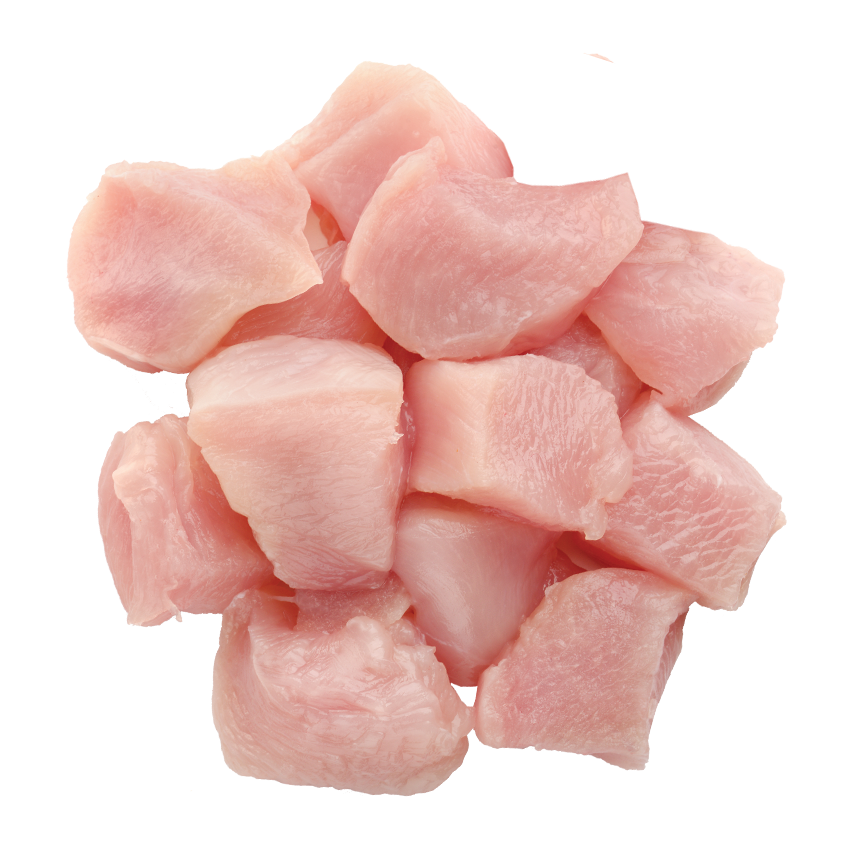 A pile of raw, cubed pink meat sits on a solid green background.