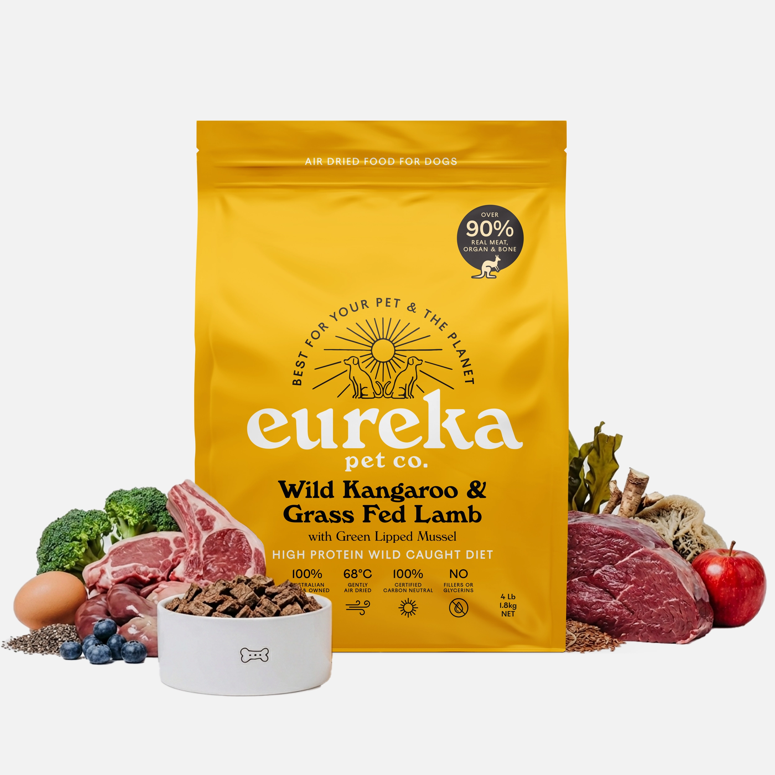 
Eureka Pet Co. Wild Kangaroo & Grass Fed Lamb air-dried dog food 1.8kg bag surrounded by fresh whole ingredients including kangaroo, grass fed lamb, broccoli, apple, blueberries, egg and green lipped mussel with a bowl of food pieces.
