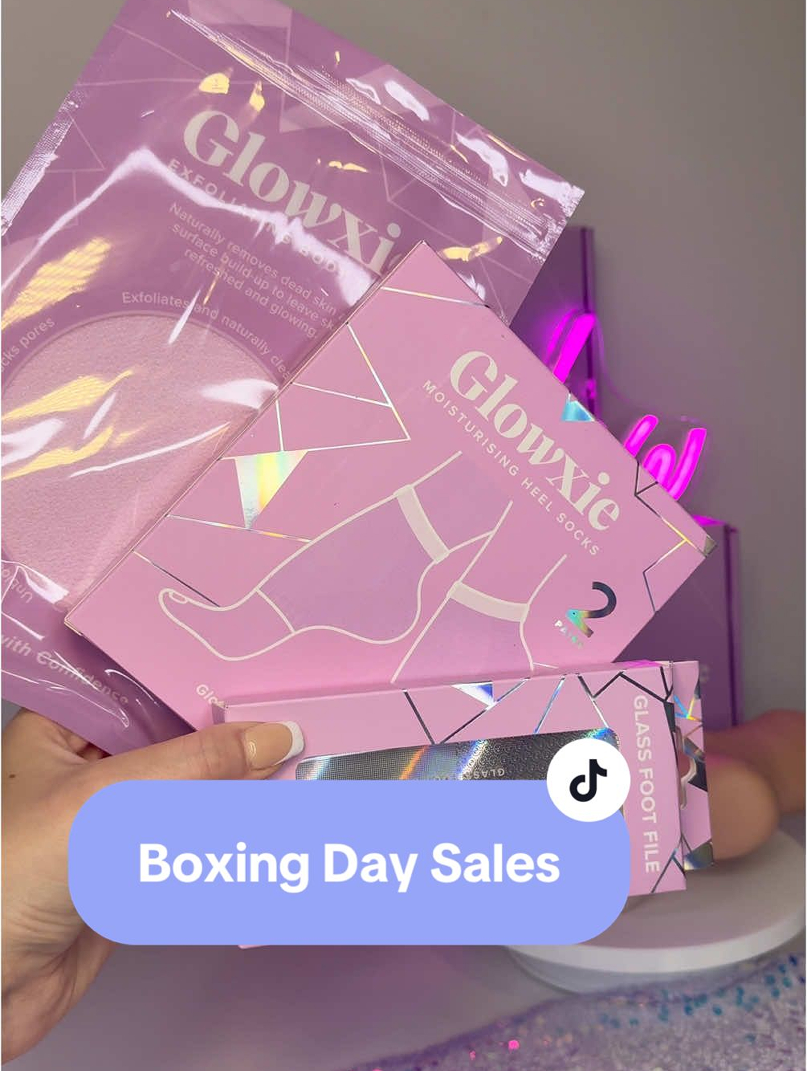 Pink skincare products with 'Boxing Day Sales' text overlay.