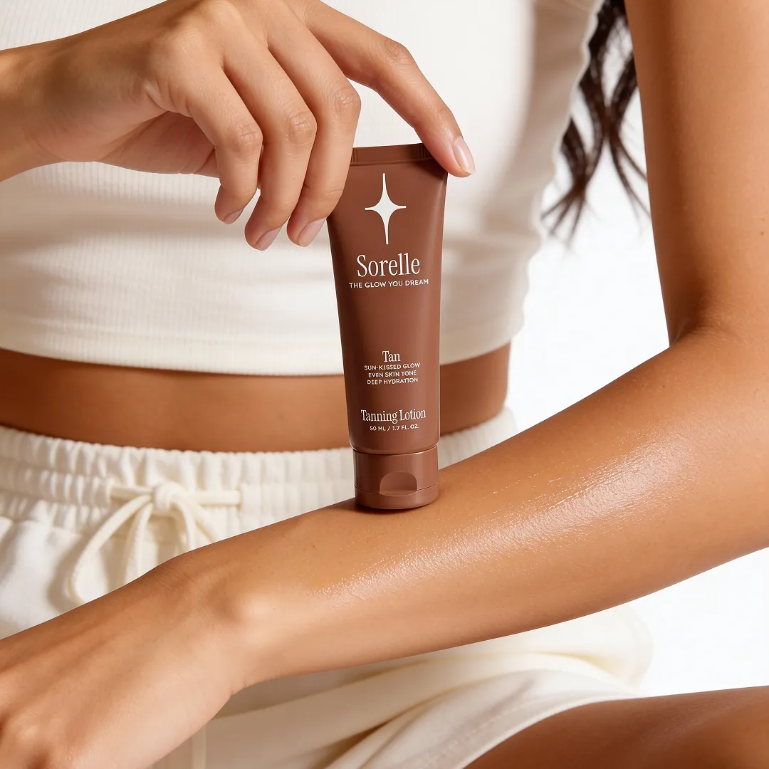 A person holds a tube of Sorelle Tanning Lotion over their arm where the product has been applied.