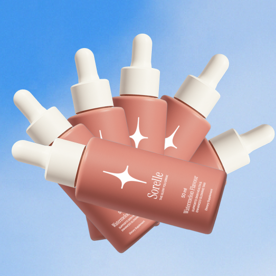 Five pink dropper bottles with white caps on a blue background.