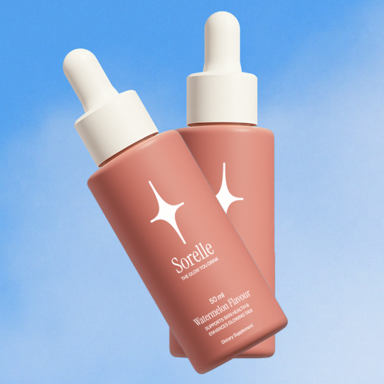 Two pink dropper bottles labeled 'Sorelle' against a blue sky background.