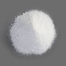 A pile of white powder on a gray background.