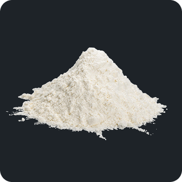 A small conical pile of fine white powder on a dark background.