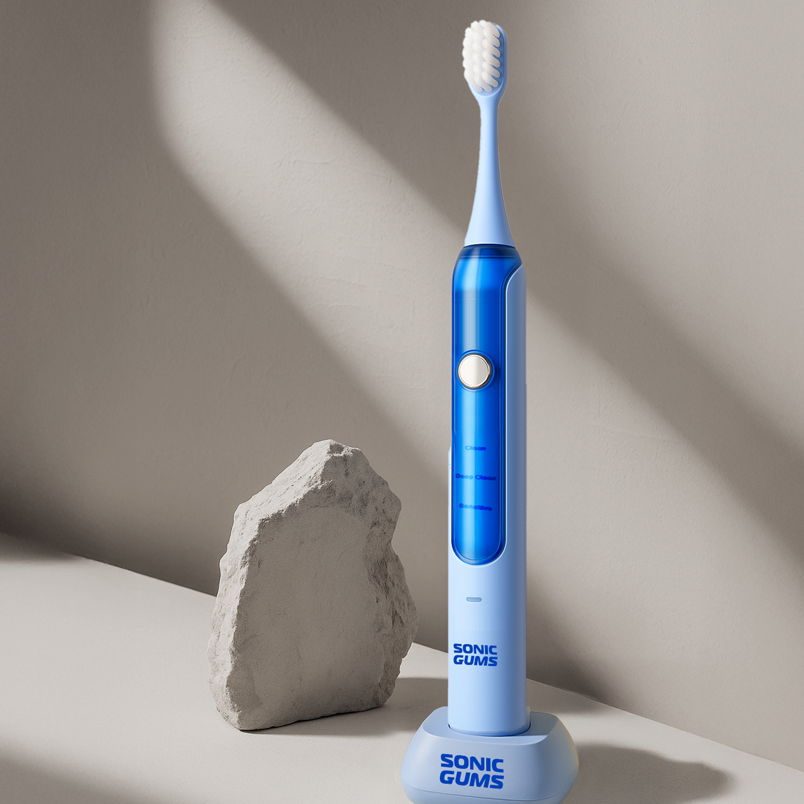 Blue electric toothbrush on a stand next to a gray rock.