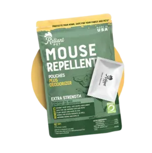 A green bag of Reliant Pet Mouse Repellent with a small white pouch next to it.