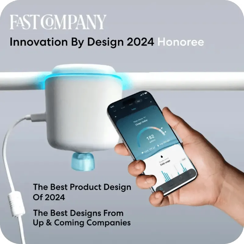 A smart device on a pipe, with a hand holding a phone showing a usage tracking app.