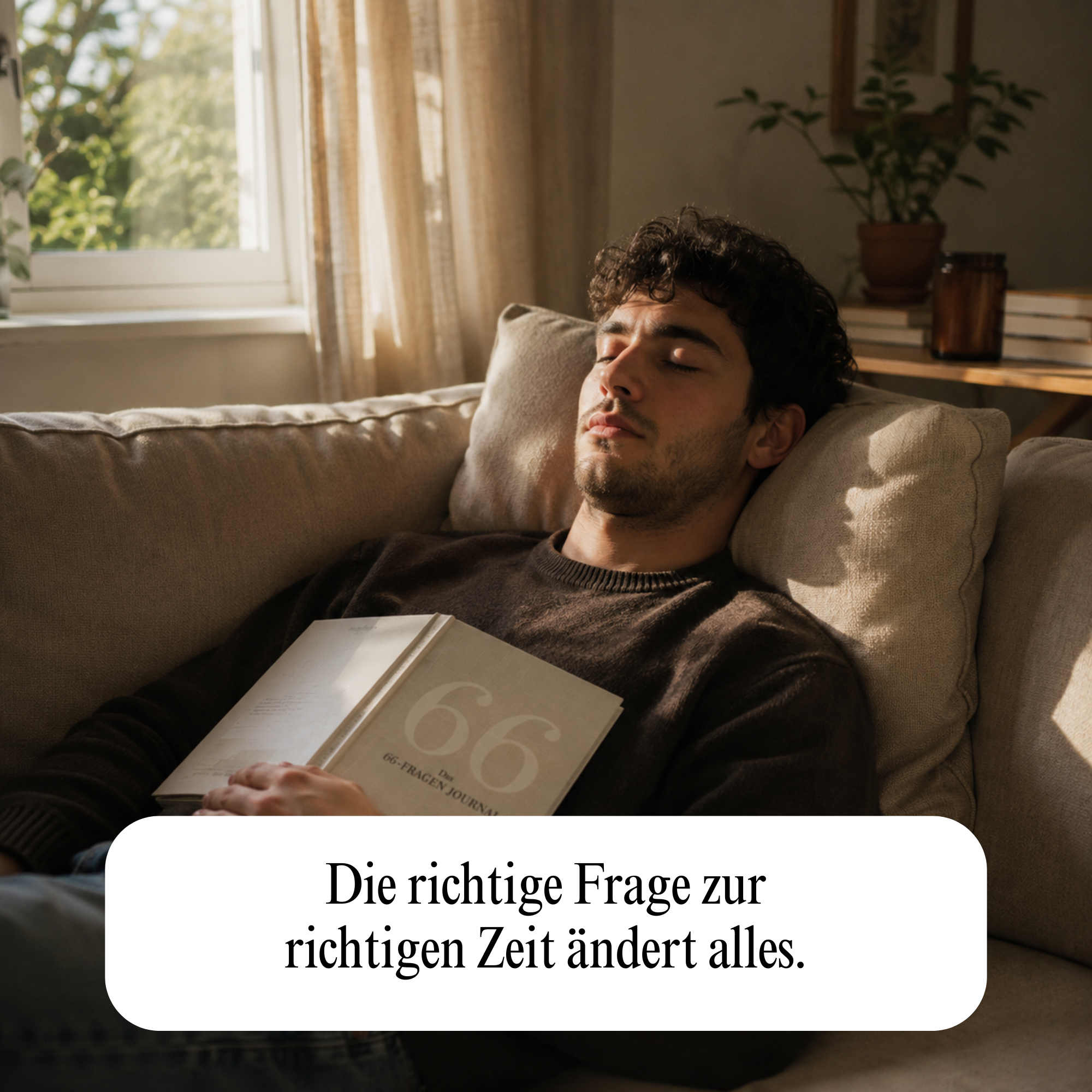 A man with dark curly hair sleeps on a couch, holding an open book on his chest.