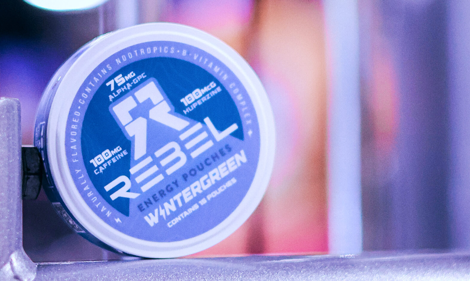 A can of Rebel energy pouches labeled 'Wintergreen' on a shelf.
