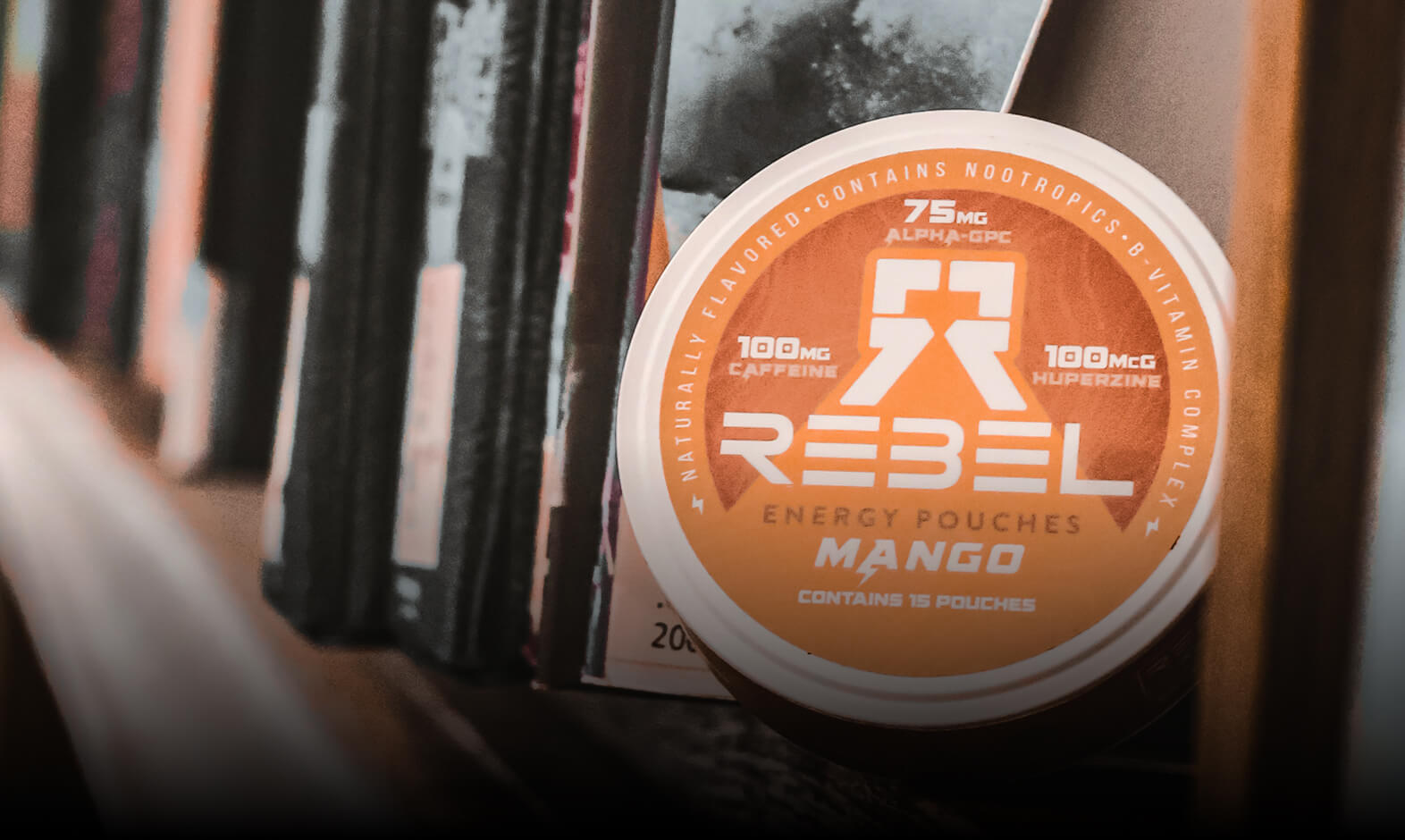 Rebel energy pouches container on a shelf with books.