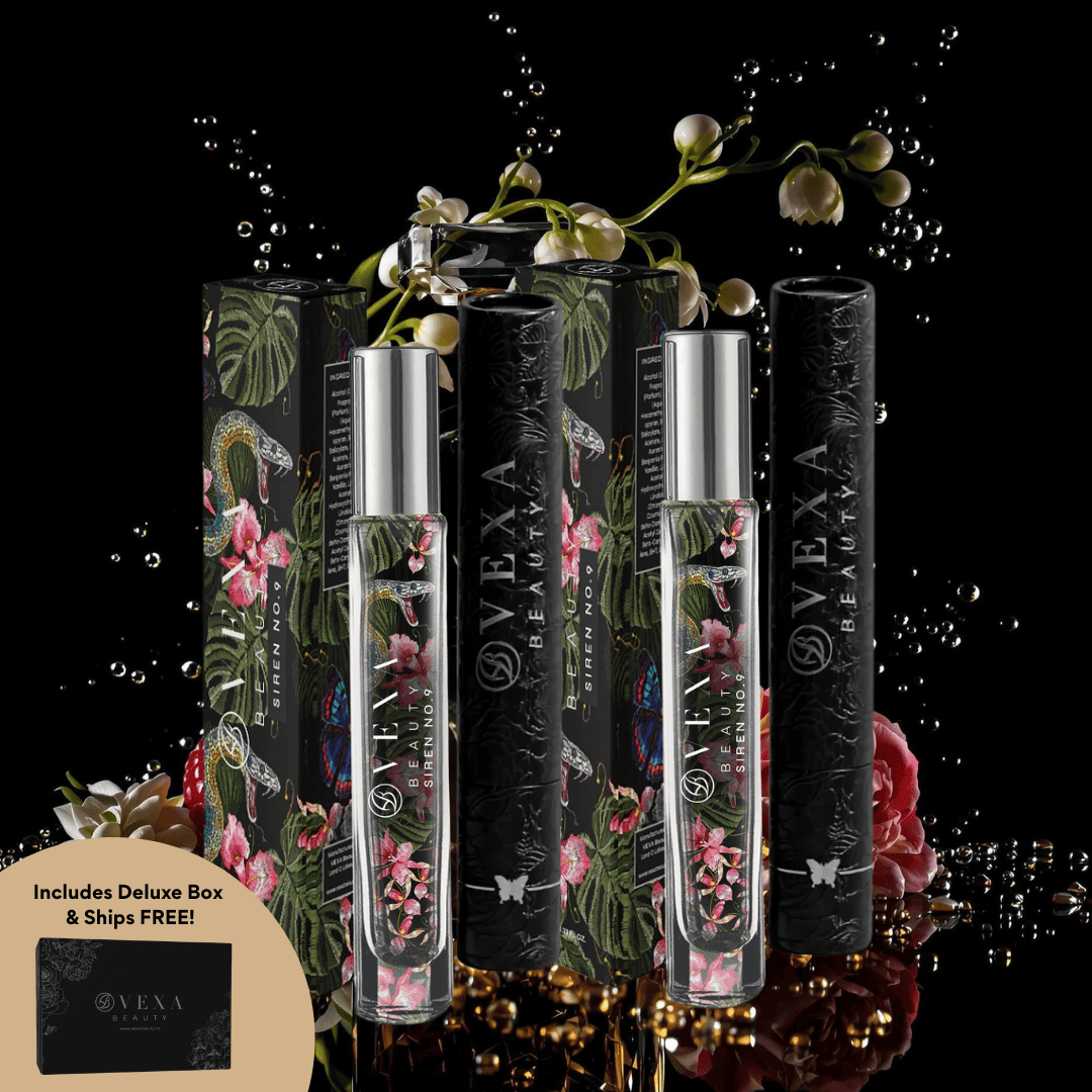 Perfume bottles with floral designs and decorative packaging set against a dark background.