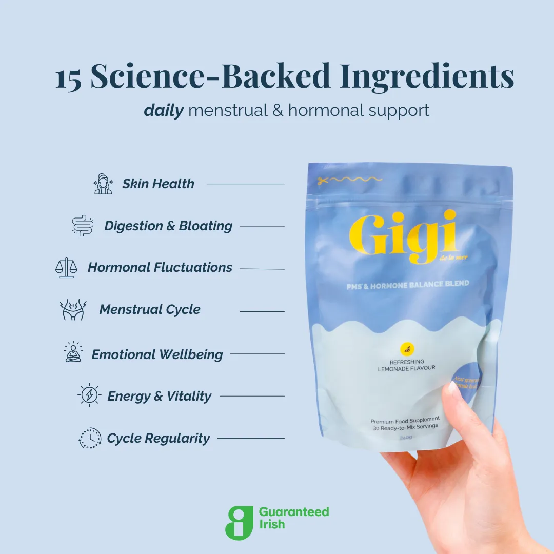 Hand holding Gigi PMS & Hormone Balance Blend package with health benefits listed.