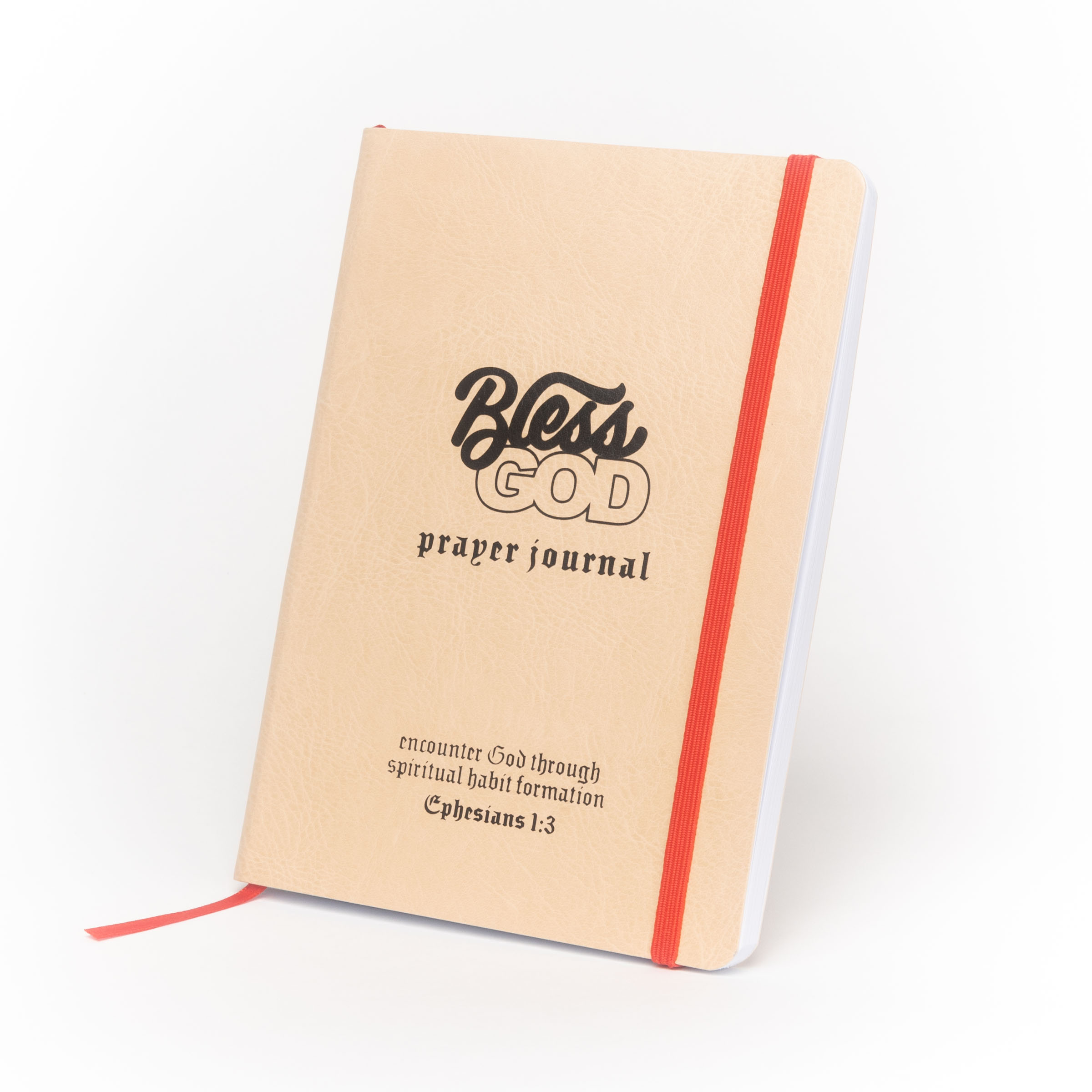 Tan prayer journal with red elastic band, titled 'Bless God' with scripture reference.