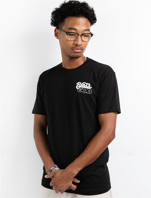 Person wearing a black T-shirt with 'Bless God' text, standing against a white background.