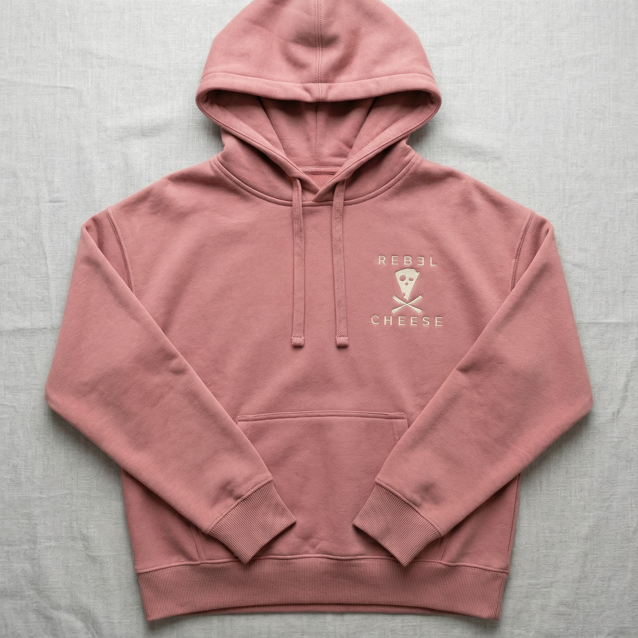 rose-colored hoodie with gold-colored Rebel Cheese logo