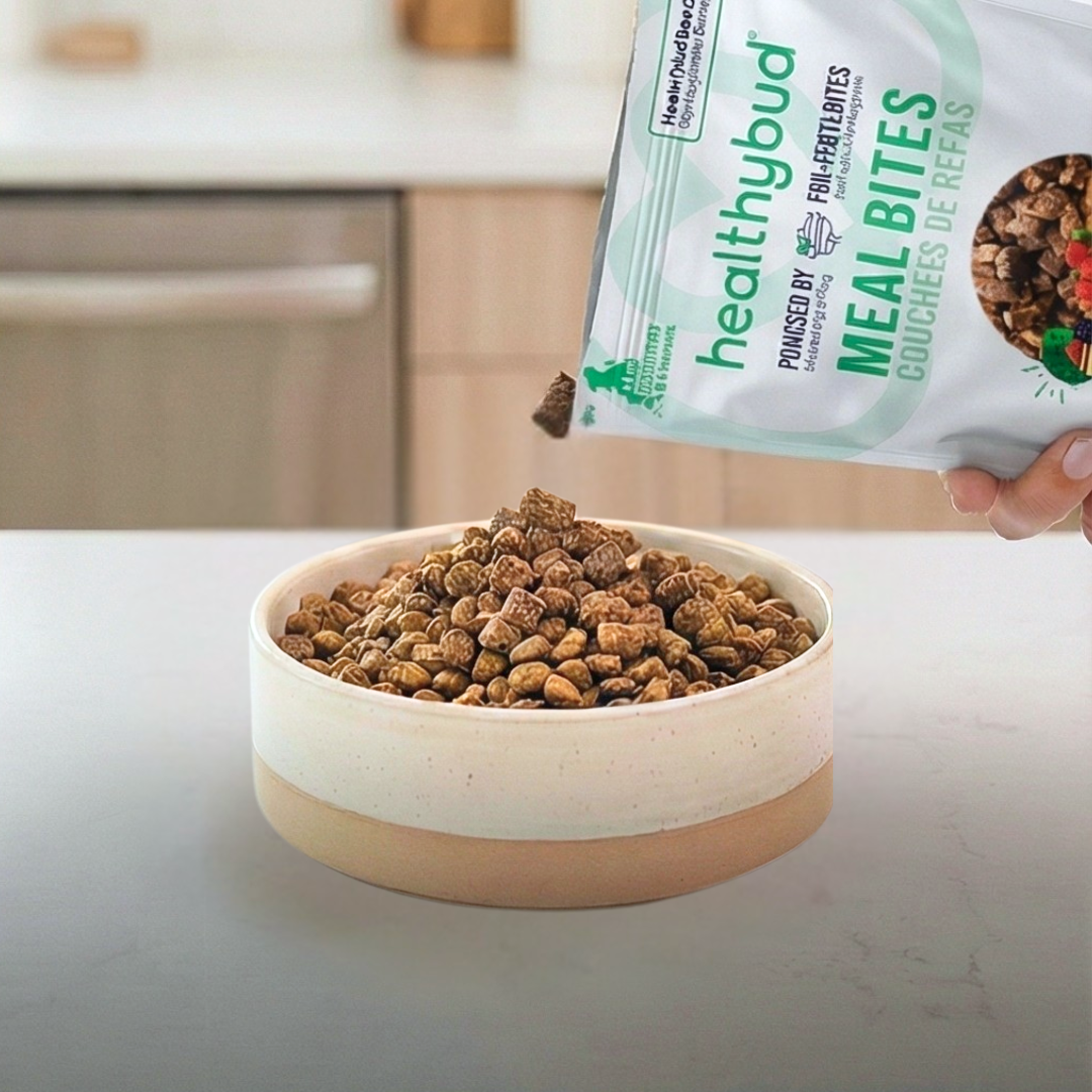 A smiling woman changing a baby's diaper with wipes on a table nearby.