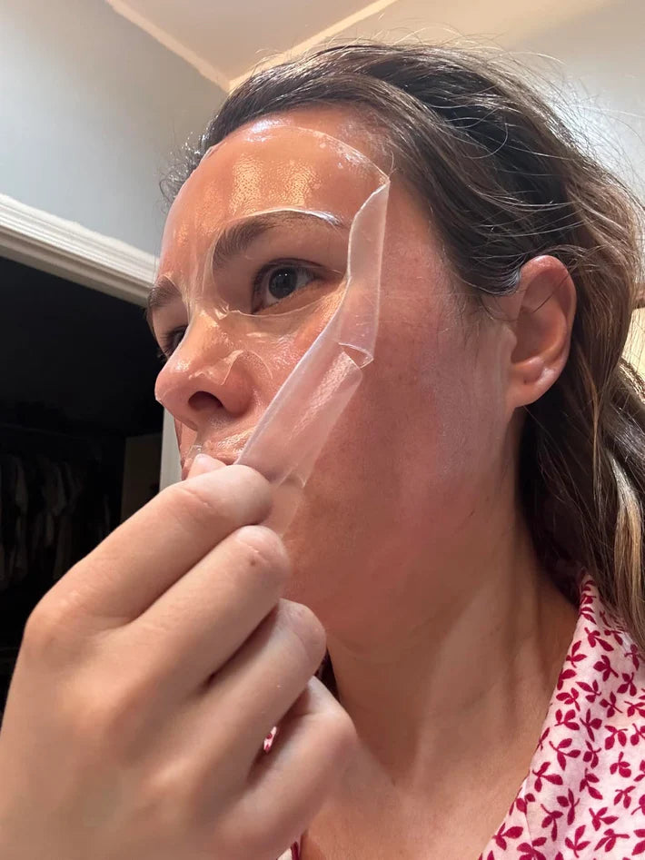 Person peeling off a face mask.