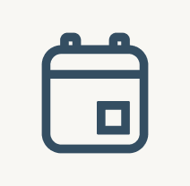 A simple, dark blue line icon of a calendar on a light background.