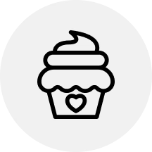 A black line icon of a cupcake with frosting and a heart on the wrapper, inside a light gray circle.