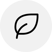 A black line icon of a single leaf inside a light gray circle.