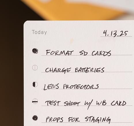 Close-up of a handwritten to-do list with five tasks and a date.