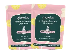 Two pink packages of feminine balance gummies with a pineapple design.